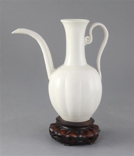 A Chinese white glazed ewer, Liao dynasty or later, 20cm high, repairs